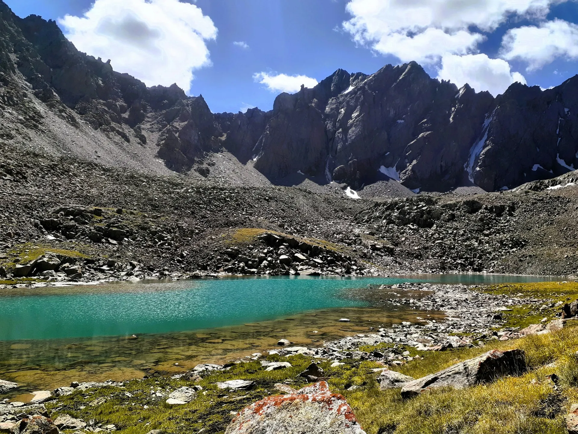 Blue mountain lake surrounded by high landscape near Skardu, Pakistan
